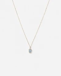 Pendentif halo Topaze bleue taille émeraude avec diamants et chaîne en or jaune 10 ct