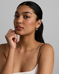 Boucles d’oreilles créoles avec pendentif cœur en or jaune 10 kt