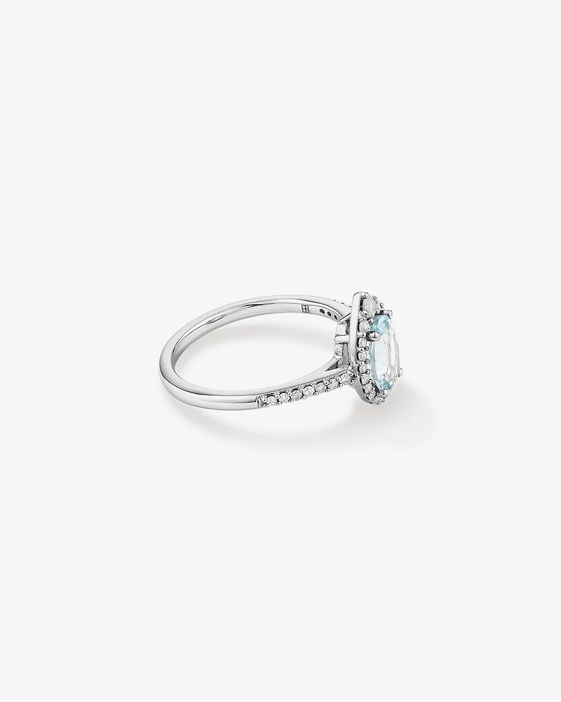 Oval Cut Blue Aquamarine Gemstone and 0.29 Carat TW Diamond Halo Ring in 10kt White Gold