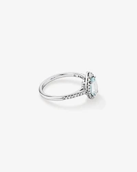 Oval Cut Blue Aquamarine Gemstone and 0.29 Carat TW Diamond Halo Ring in 10kt White Gold