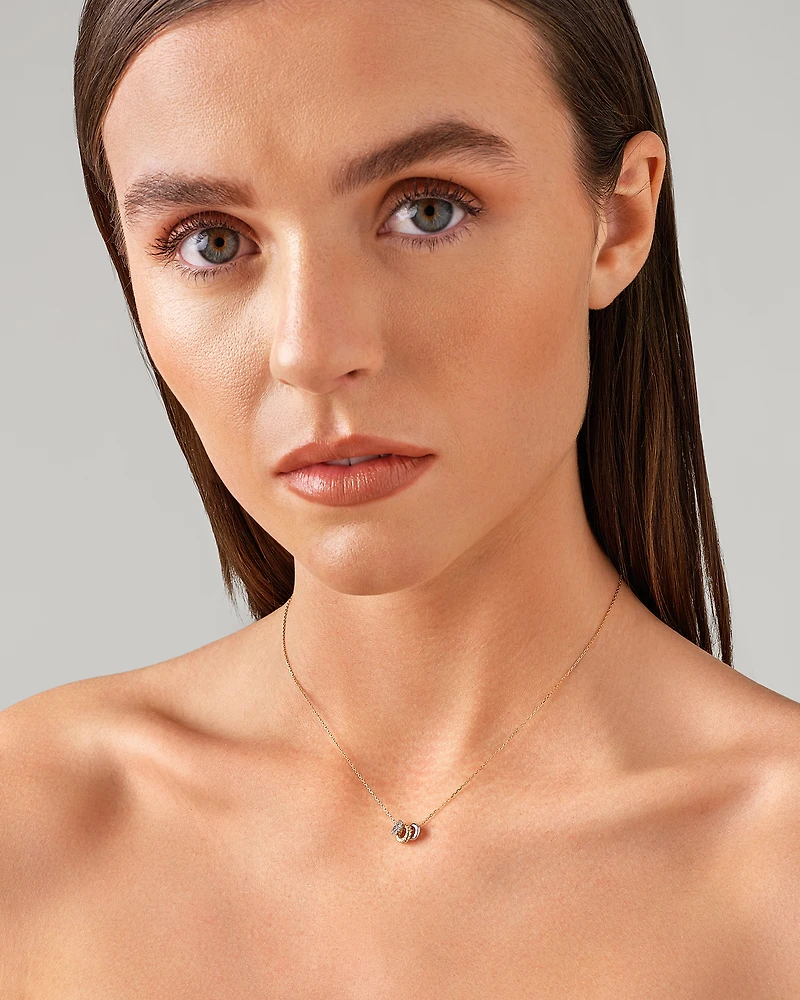 Trio Pendant with .09 Carat TW Diamonds in Sterling Silver and 10kt Yellow gold