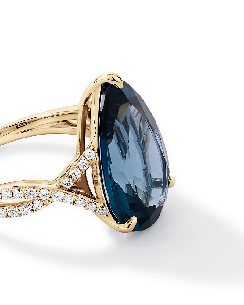 Pear Cut London Blue Topaz & 0.28 Carat TW Diamond Twist Ring 10kt Yellow Gold