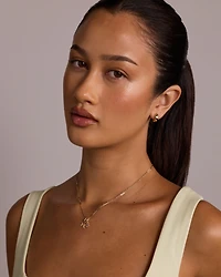 Snowflake Pendant with Round Created Sapphire in 10kt Yellow Gold