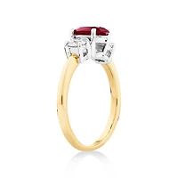 Bague en or blanc et jaune 14 K avec rubis et diamants totalisant 0,40 ct