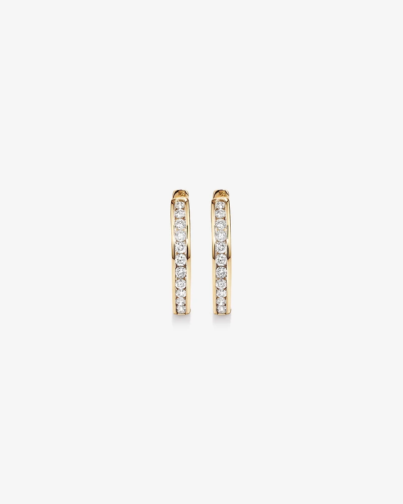 0.25 Carat TW Channel Set Round Brilliant Diamond Huggie Hoop Earrings in 10kt Yellow Gold