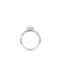0.75 Carat TW Oval Cut Diamond Twist Side Accent Halo Engagement Ring in 14kt White Gold