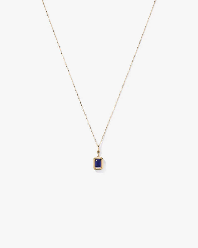Emerald Cut Created Sapphire Bezel Pendant with Chain in 10kt Yellow Gold