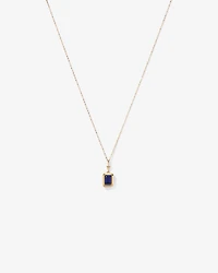 Emerald Cut Created Sapphire Bezel Pendant with Chain in 10kt Yellow Gold