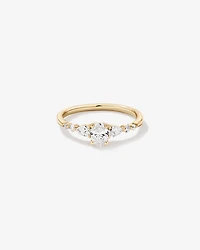 0.59 Carat TW Oval and Pear Sidestone Engagement Ring in 14kt Yellow Gold