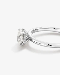 0.68 Carat TW Oval Cut Diamond Solitaire Hidden Pave Halo Engagement Ring in Platinum