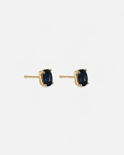 Boucles d'oreilles puces ovales Topaze bleu London en or jaune 10 ct