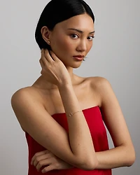 Bracelet pièce cheval avec grenats en or jaune 10 kt