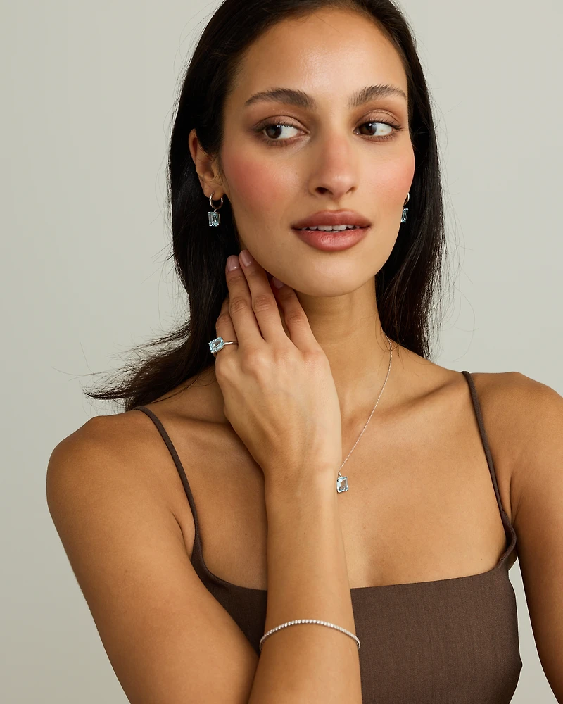 Emerald Cut Sky Blue Topaz Drop Earrings in Sterling Silver