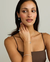 Emerald Cut Sky Blue Topaz Drop Earrings in Sterling Silver