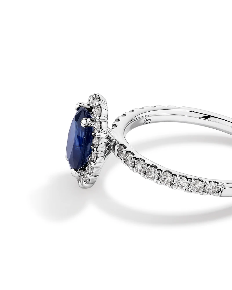 Oval Cut Blue Sapphire Gemstone and 0.60 Carat TW Diamond Halo Ring in 14kt White Gold