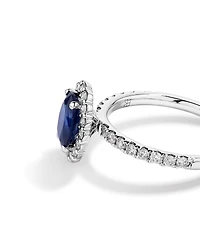 Oval Cut Blue Sapphire Gemstone and 0.60 Carat TW Diamond Halo Ring in 14kt White Gold
