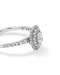 0.58 Carat TW Oval Diamond Halo Baguette Side Accent Engagement Ring in 14kt White Gold