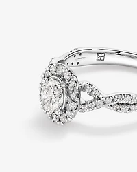 0.75 Carat TW Oval Cut Diamond Twist Side Accent Halo Engagement Ring in 14kt White Gold