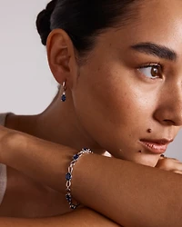 Oval Cut Blue Created Ceylon Sapphire Gemstone and Diamond Drop Huggie Earrings in Sterling Silver