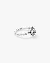 0.58 Carat TW Oval Diamond Halo Baguette Side Accent Engagement Ring in 14kt White Gold