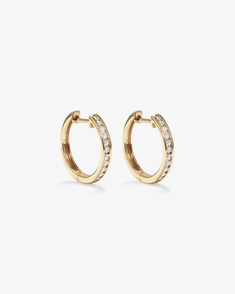 0.25 Carat TW Channel Set Round Brilliant Diamond Huggie Hoop Earrings in 10kt Yellow Gold