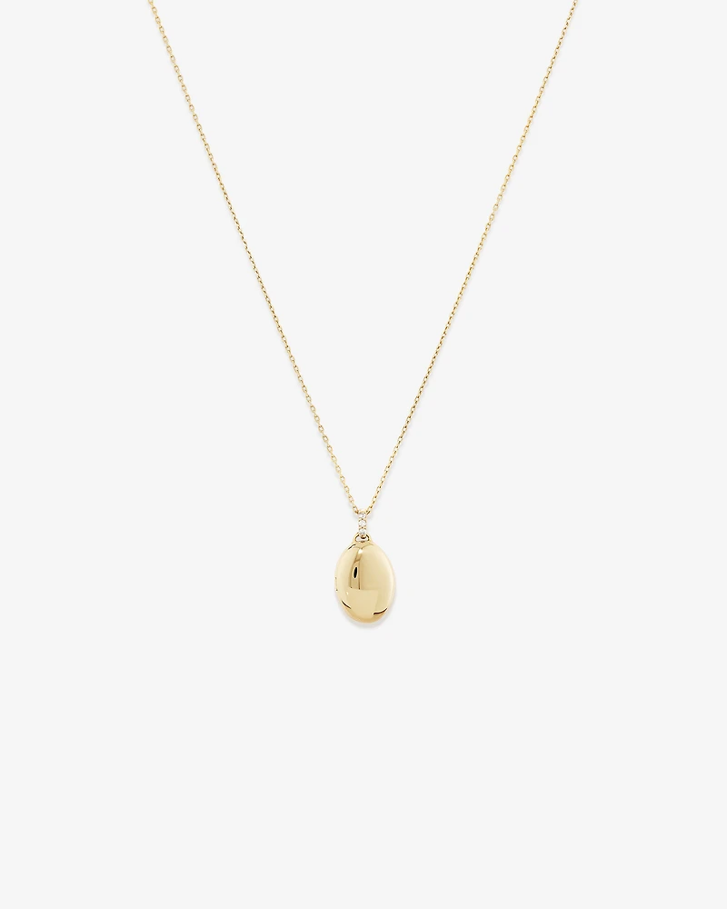 Médaillon ovale orné de diamants en or jaune 10kt