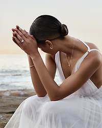 1.10 Carat TW Oval & Pear Cut Three Stone Engagement Ring in 18kt White Gold