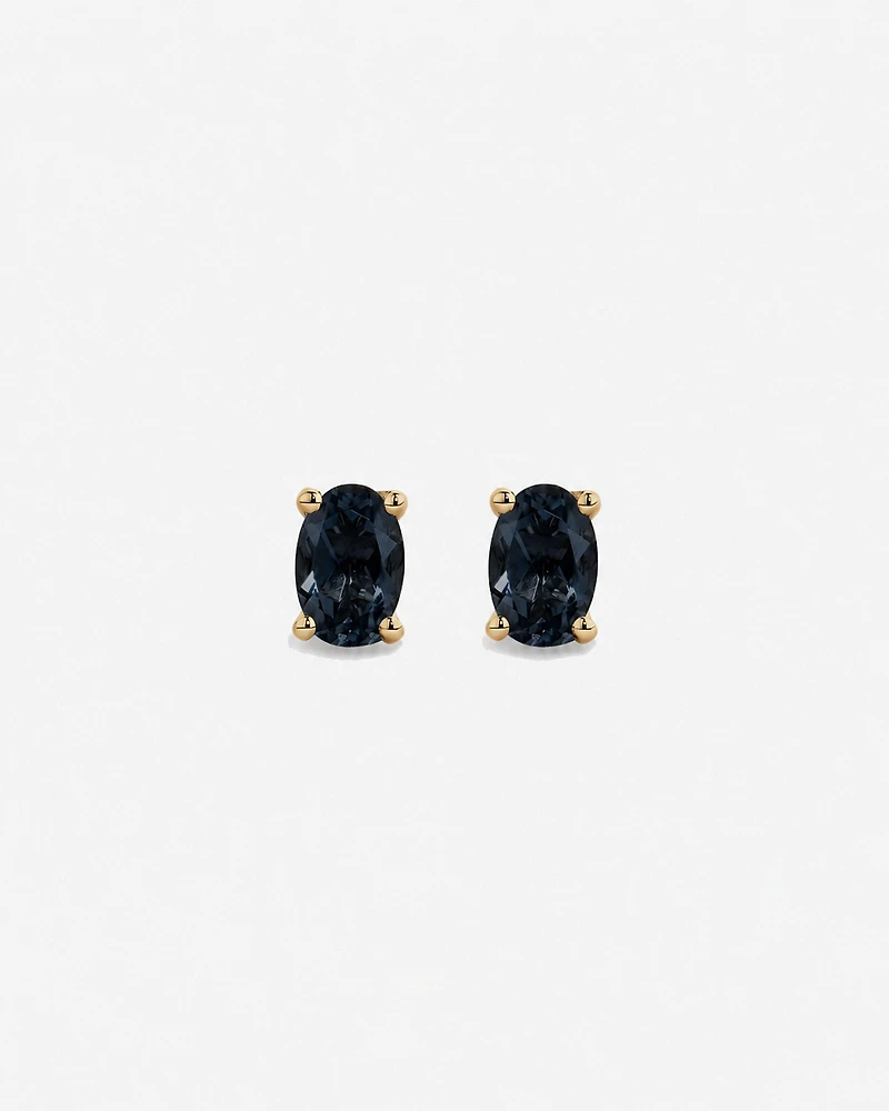 Boucles d'oreilles puces ovales Topaze bleu London en or jaune 10 ct
