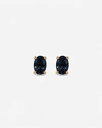 Boucles d'oreilles puces ovales Topaze bleu London en or jaune 10 ct