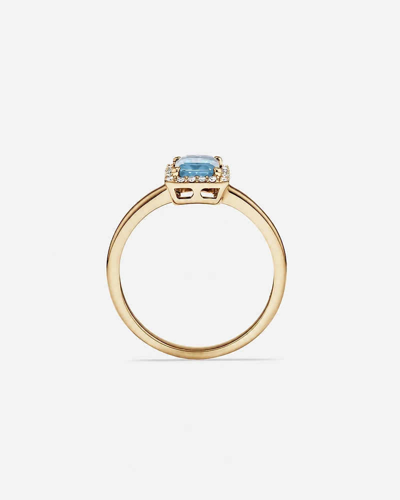 Emerald Cut Blue Topaz and Diamond Halo Ring in 10kt Yellow Gold
