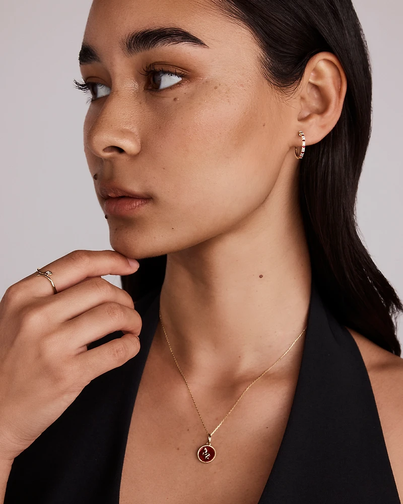 0.22 Carat TW Diamond and Created Ruby Huggie Hoop Earrings in 10kt Yellow Gold