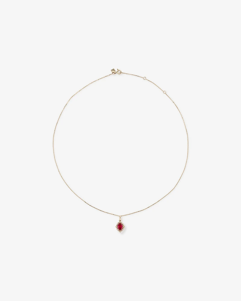 Oval Cut Created Ruby and Diamond Halo Pendant Necklace in 10kt Yellow Gold