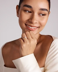 0.59 Carat TW Oval and Pear Sidestone Engagement Ring in 14kt Yellow Gold