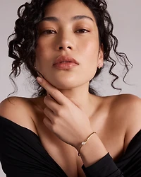 0.60 Carat TW of Laboratory-Grown Pear Cut Diamond Torque Bangle in 10kt Yellow Gold