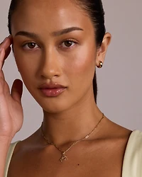 Gingerbread Pendant with Round Created Rubies in 10kt Yellow Gold