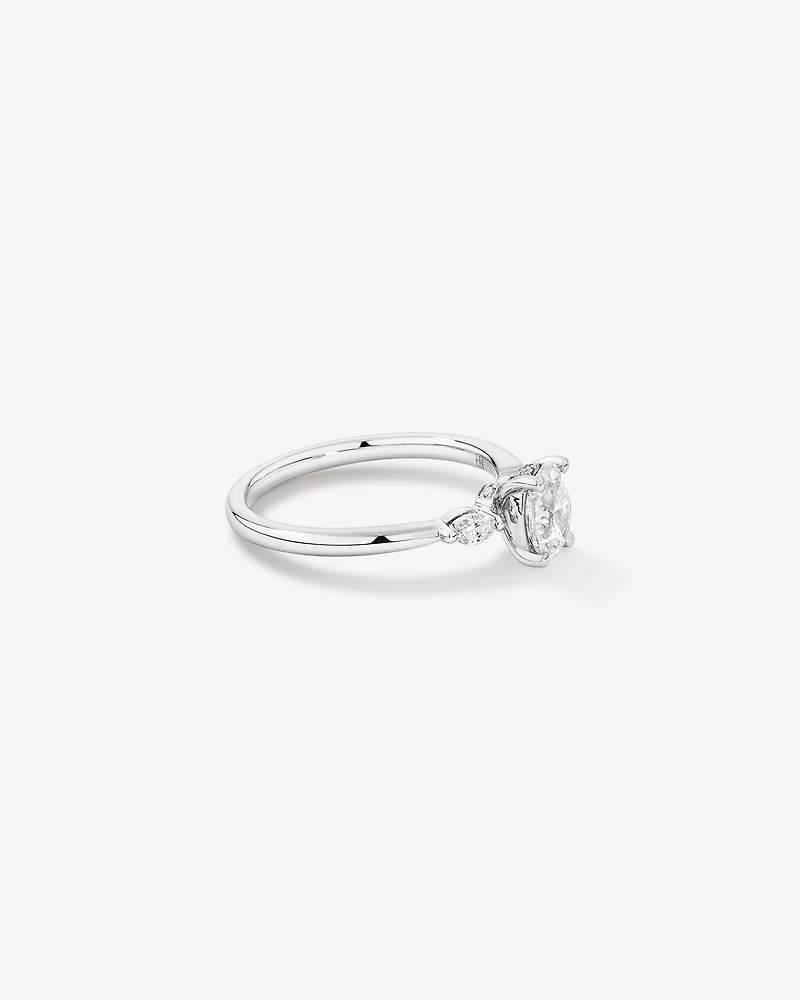 0.77 Carat TW Three Stone Oval and Marquise Cut Hidden Halo Engagement Ring in Platinum