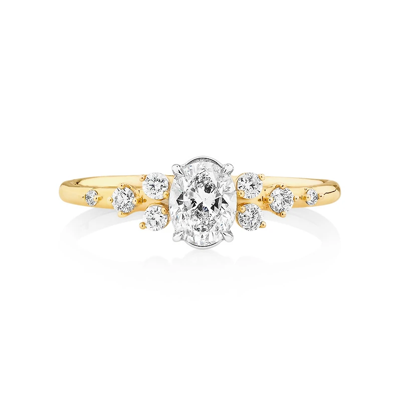 Bague à halo ovale en or blanc et jaune 14 K à diamants dispersés totalisant 0,63 ct