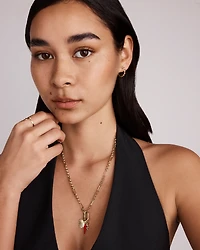 0.22 Carat TW Diamond and Created Ruby Huggie Hoop Earrings in 10kt Yellow Gold