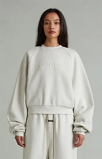 Fear of God ESSENTIALS Women's Heather Oatmeal '90s Embossed Raglan Cropped Crew Neck Sweatshirt