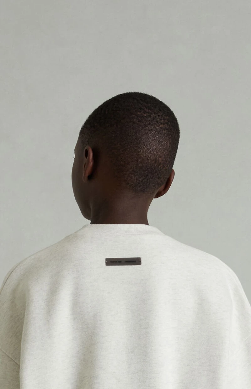 Fear of God ESSENTIALS Kids Heather Oatmeal Embossed Classic Crew Neck Sweatshirt