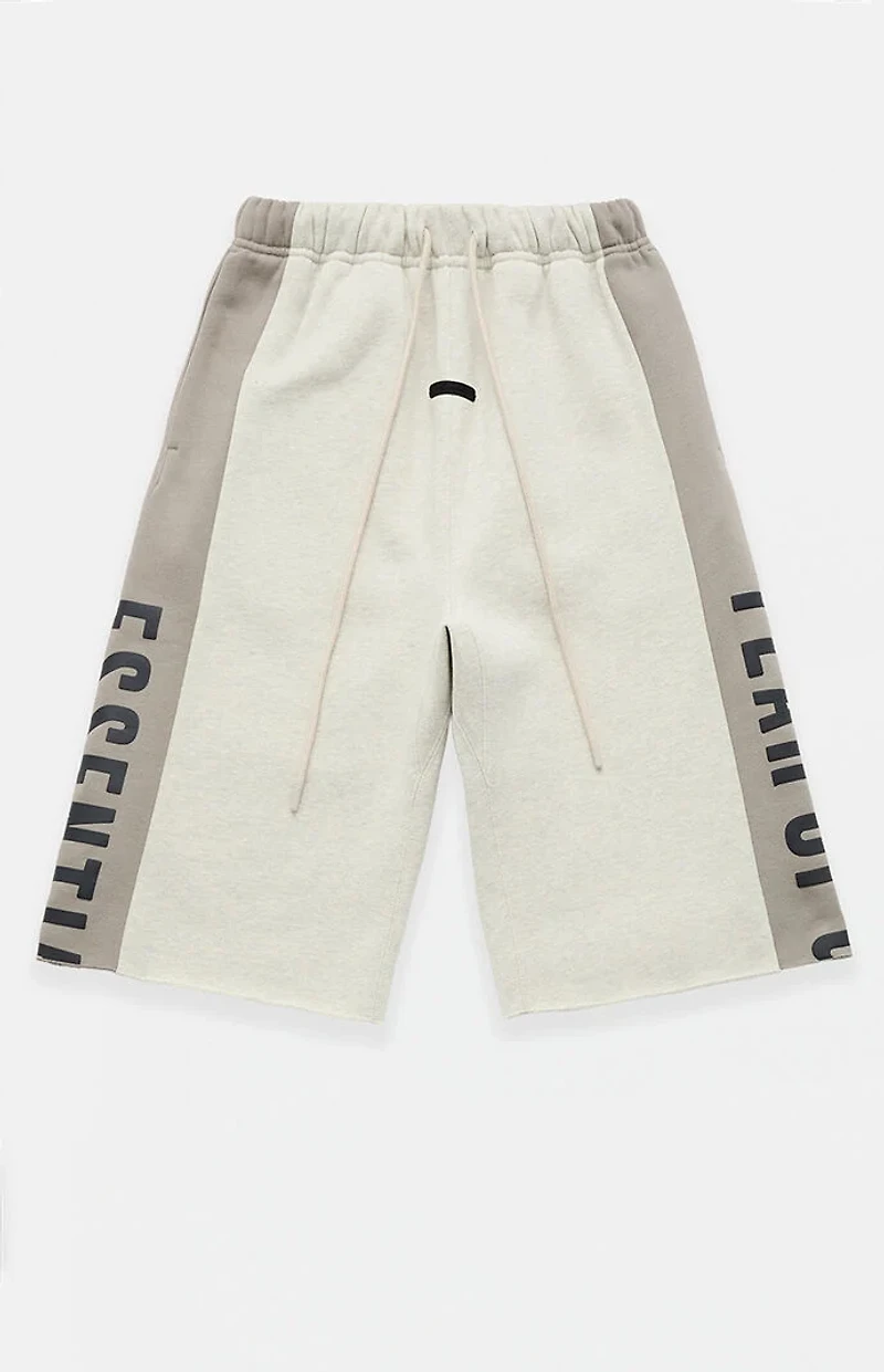 Fear of God ESSENTIALS Vanilla Paneled Raw Cutoff Sweat Shorts