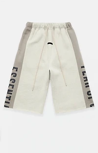 Fear of God ESSENTIALS Vanilla Paneled Raw Cutoff Sweat Shorts