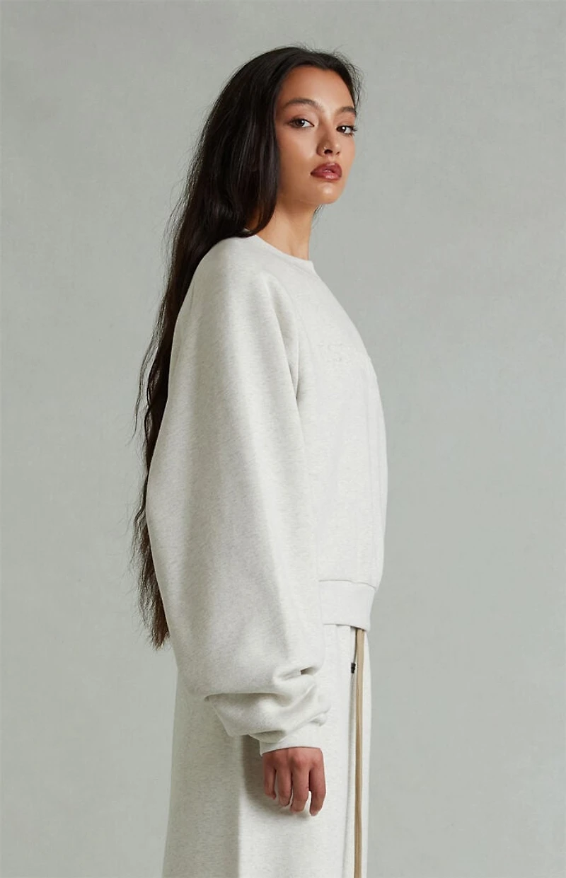Fear of God ESSENTIALS Women's Heather Oatmeal '90s Embossed Raglan Cropped Crew Neck Sweatshirt