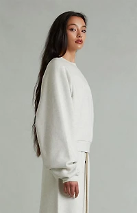 Fear of God ESSENTIALS Women's Heather Oatmeal '90s Embossed Raglan Cropped Crew Neck Sweatshirt