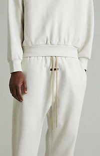 Fear of God ESSENTIALS Heather Oatmeal Fleece Flare Sweatpants