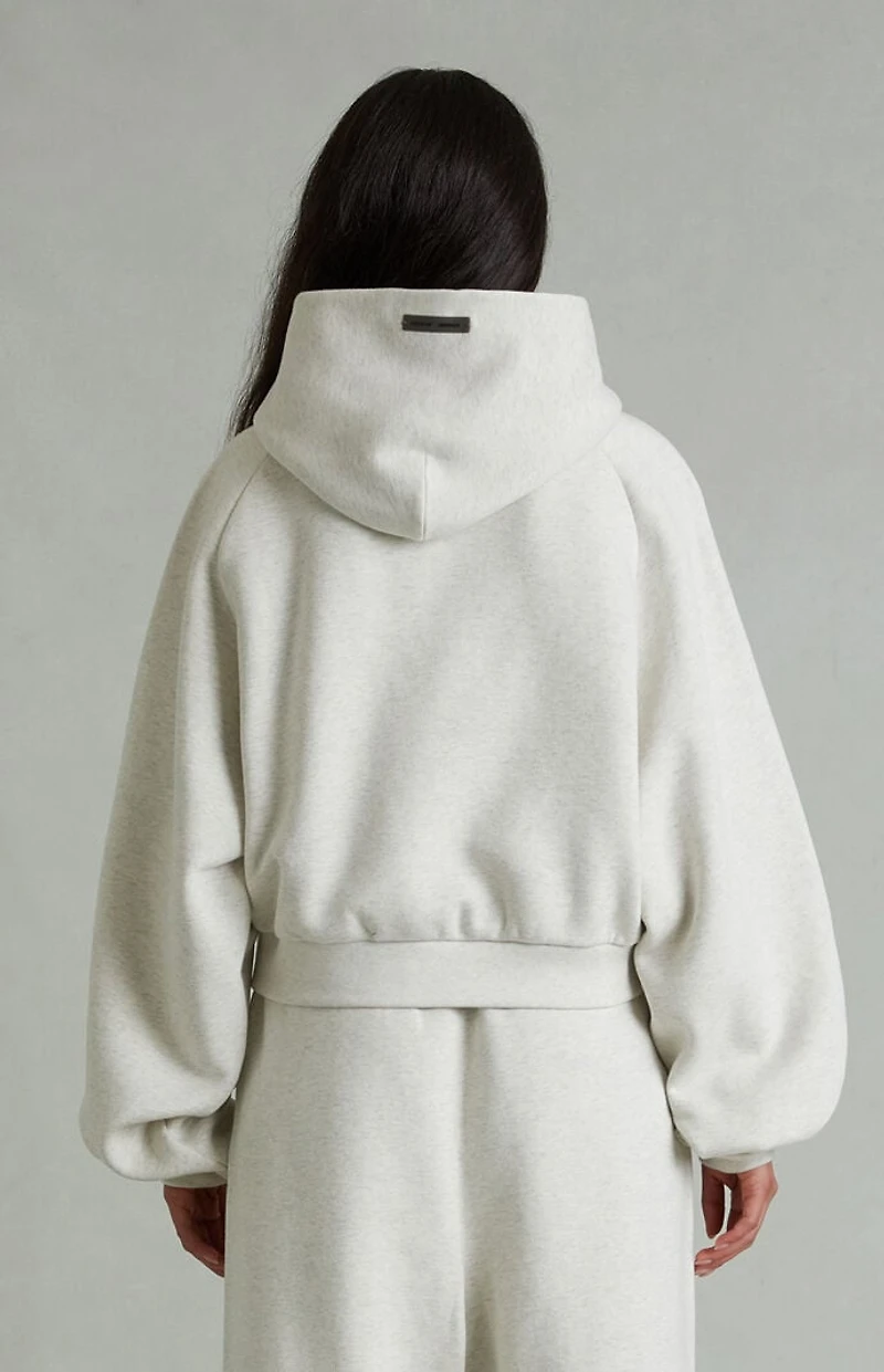 Fear of God ESSENTIALS Women's Heather Oatmeal '90s Embossed Raglan Cropped Hoodie