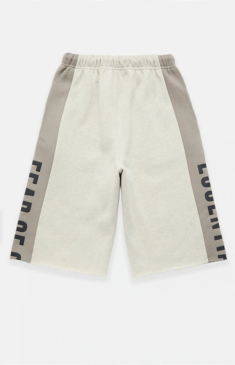 Fear of God ESSENTIALS Vanilla Paneled Raw Cutoff Sweat Shorts