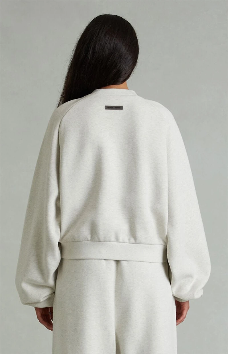 Fear of God ESSENTIALS Women's Heather Oatmeal '90s Embossed Raglan Cropped Crew Neck Sweatshirt