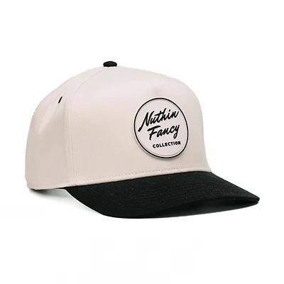 Comus Two Toned Trucker Hat in White and Black