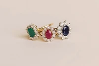 Oval Halo Ring with Ruby and .12 Carat TW of Diamonds in 10kt Yellow Gold
